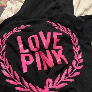 It’s black sparkly and it’s a zip up